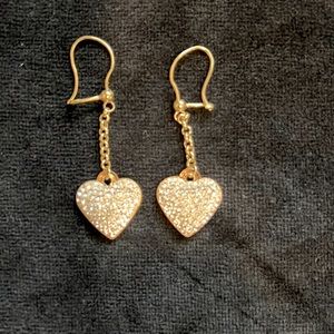 10k yellow gold earrings, the stones aren't diamonds.
